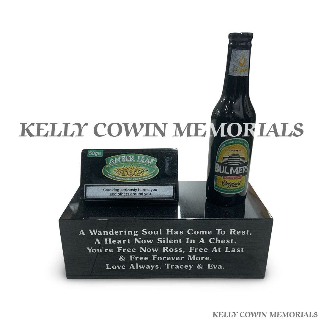 Front view of black granite Bulmers bottle and tobacco pouch memorial