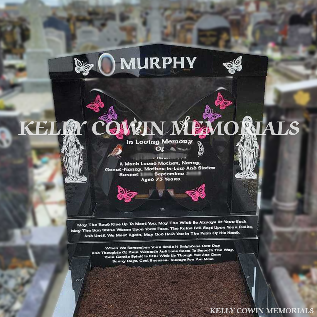 Front view of black granite butterfly headstone with white inscription and coloured butterfly engraving in Fingal Cemetery Dublin