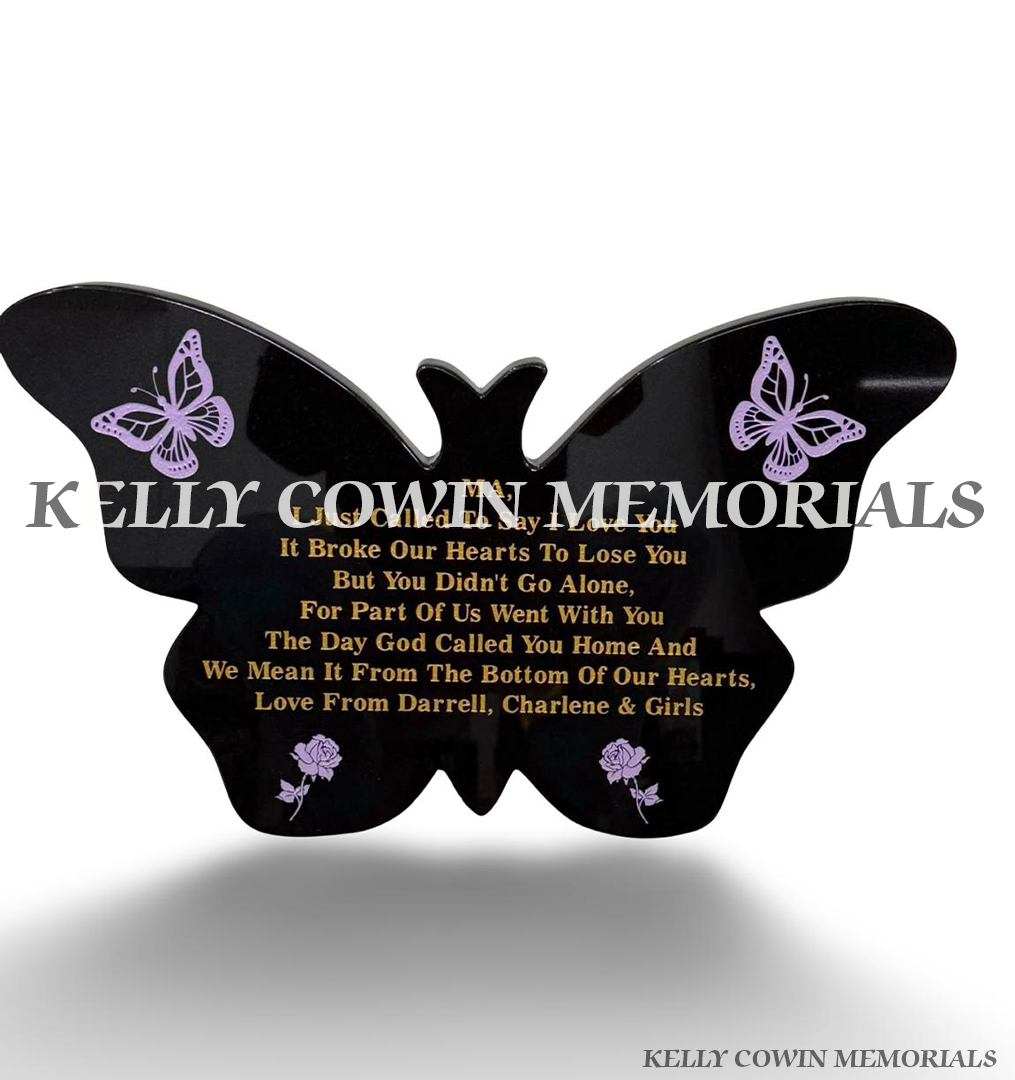 Personalised black granite butterfly memorial plaque with gold inscription, purple butterflies, roses and freestanding granite support by Kelly Cowin Memorials.