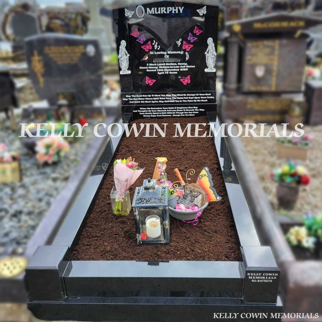Front view of black granite butterfly headstone with white inscription and coloured butterfly engraving in Fingal Cemetery Dublin