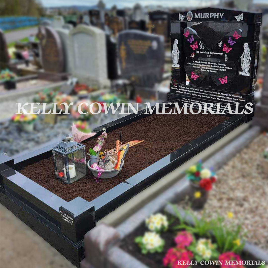 Side view showing cap, pillars, full black granite kerbing and corner posts in Fingal Cemetery Dublin