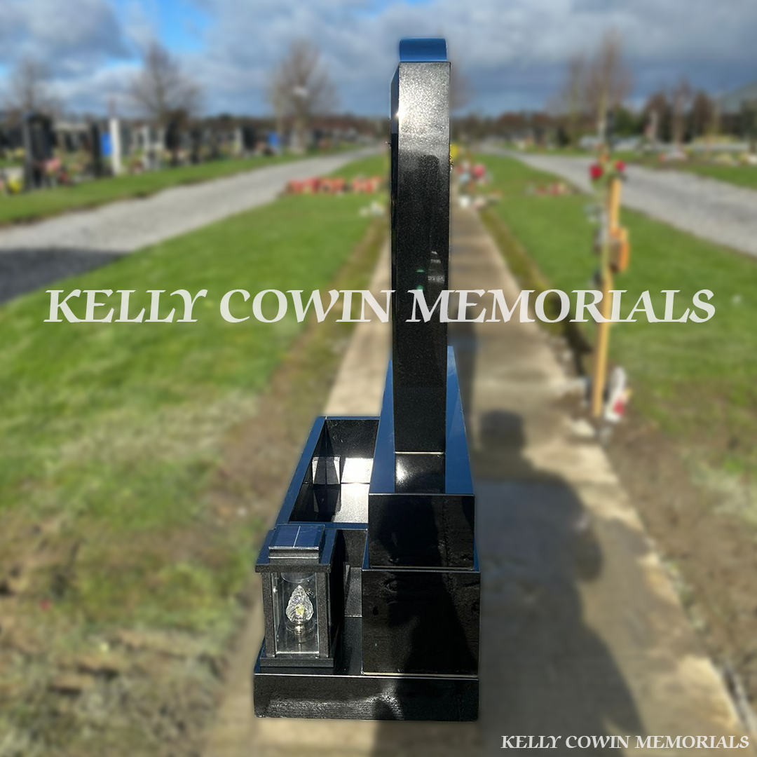 Side view of black granite C1 memorial on sub-base, base and plinth in Dardistown Cemetery