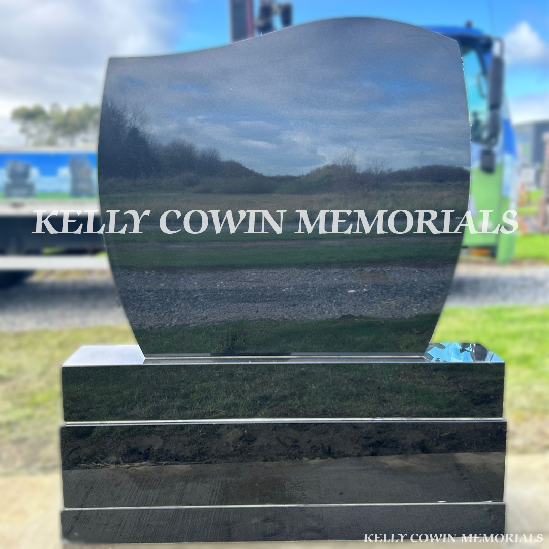 Side view of black granite C1 memorial on sub-base, base and plinth in Dardistown Cemetery