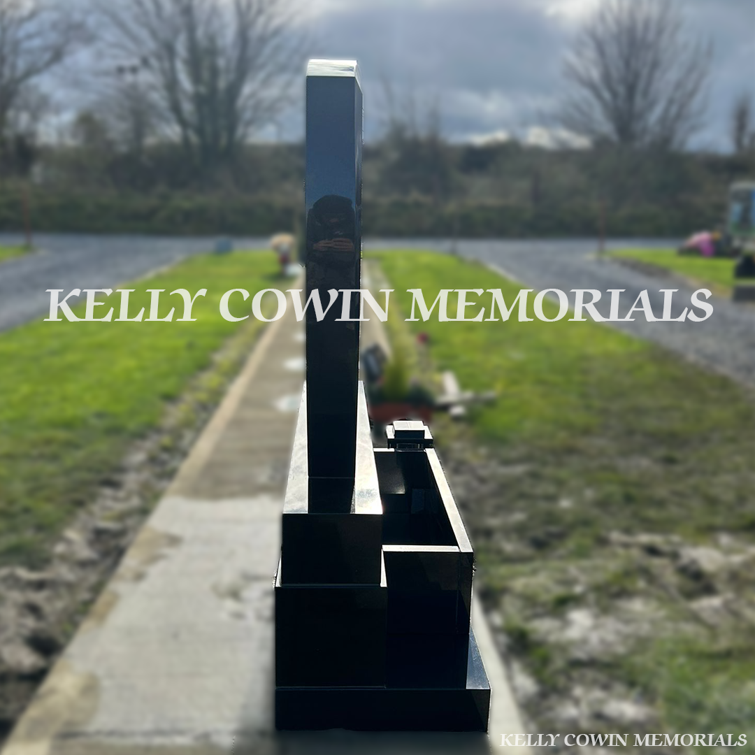 Side view of black granite C1 memorial on sub-base, base and plinth in Dardistown Cemetery