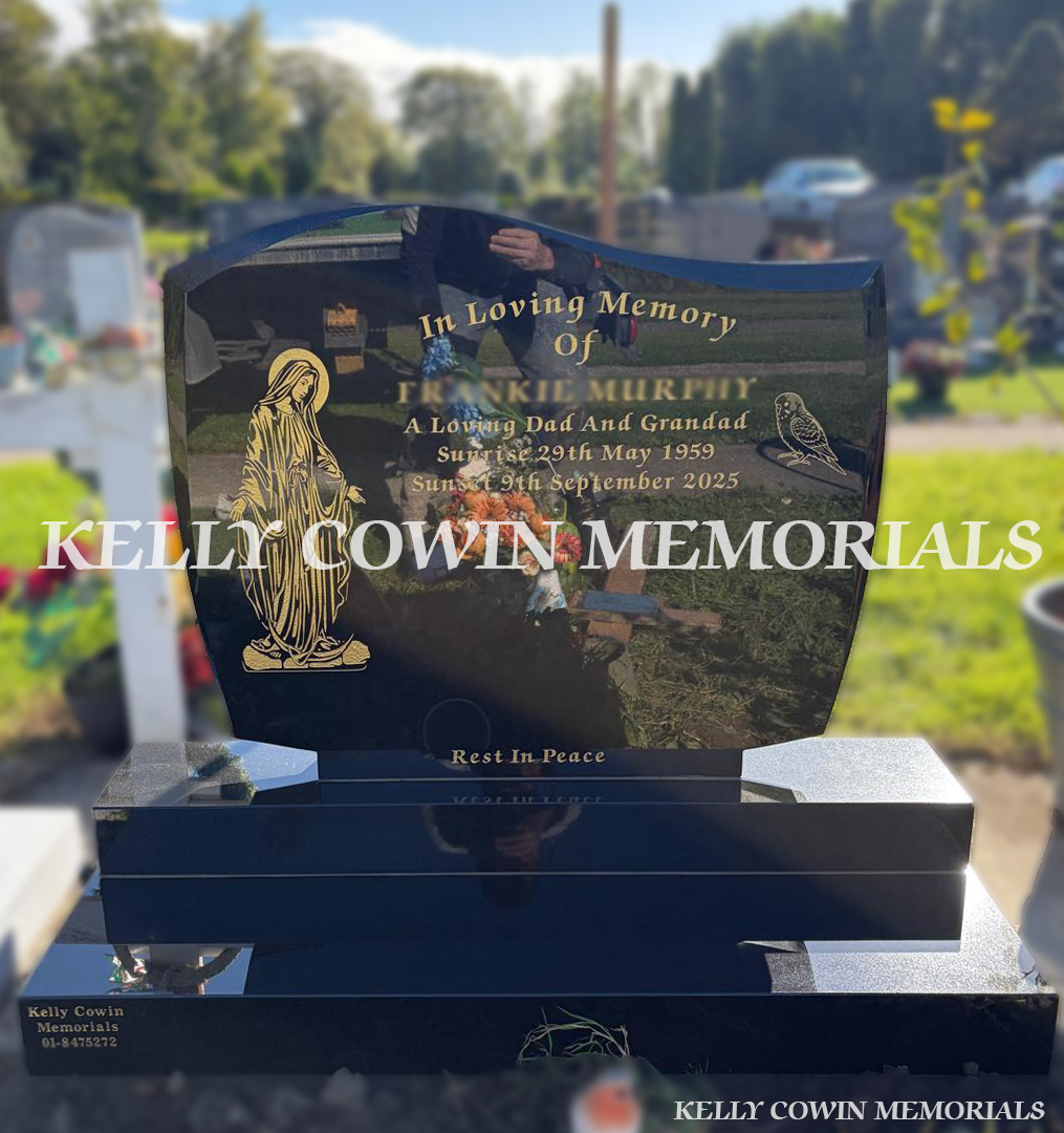 Polished black granite C1 headstone with curved top, gold inscription, Our Lady engraving, decorative bird design and matching granite base and plinth, erected in Piltown Cemetery, Co. Meath, by Kelly Cowin Memorials.