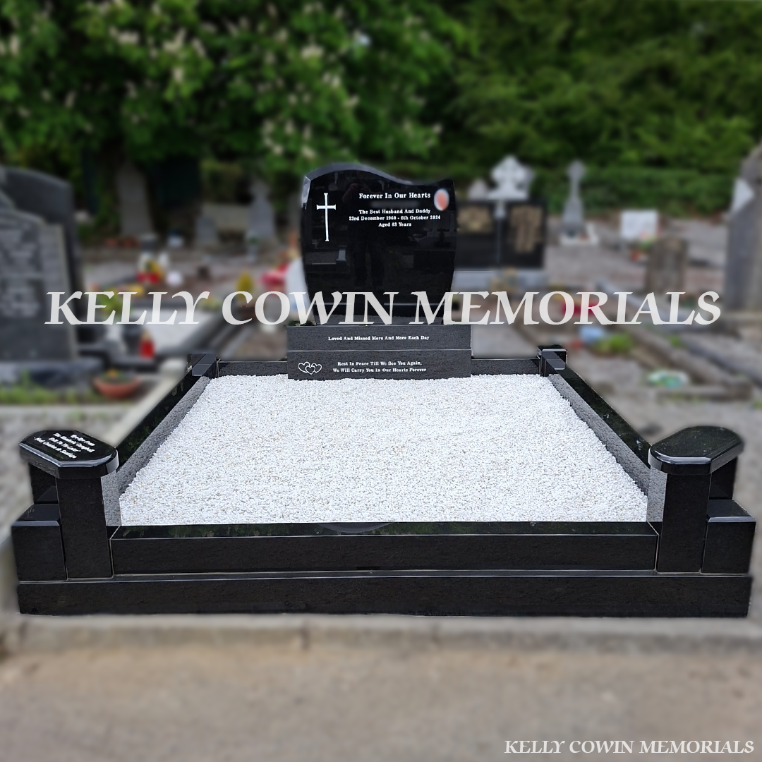 Front view of black granite C1 headstone with white inscription in Calvary Cemetery Drogheda