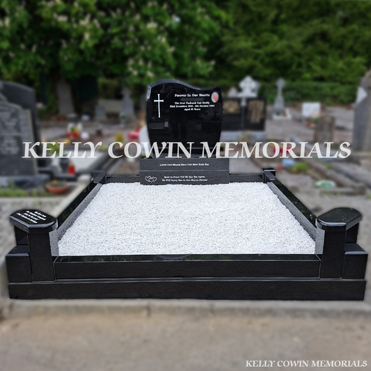 Front view of black granite C1 headstone with white inscription in Calvary Cemetery Drogheda