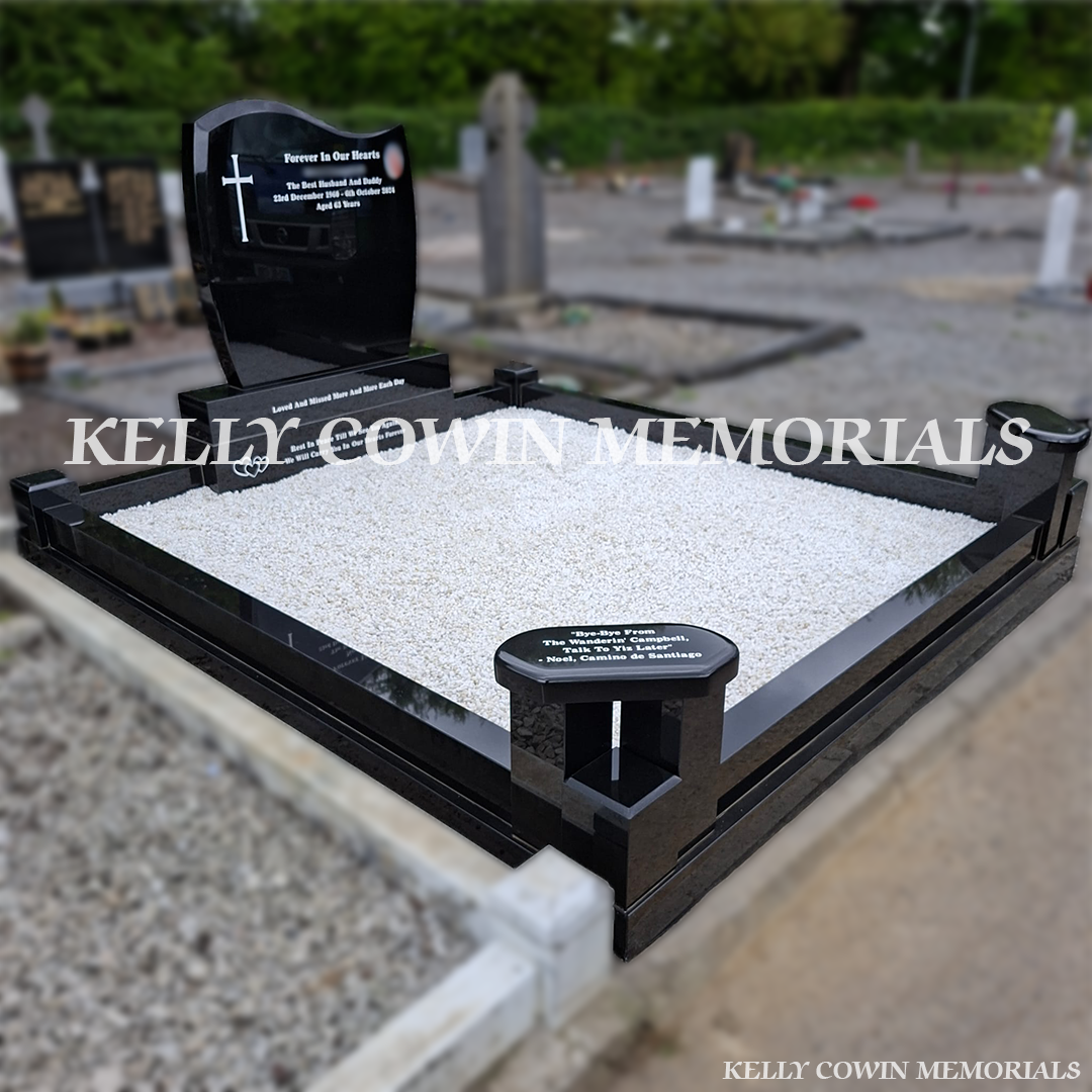 Side view of black granite memorial with kerbing and white chippings