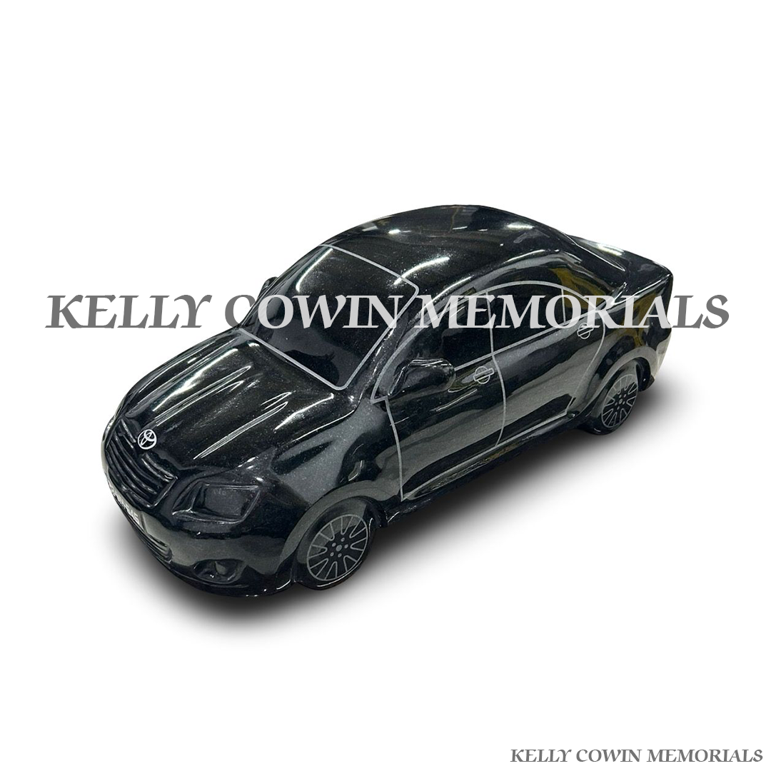 Front view of black granite Toyota Avensis memorial accessory on Pandora plinth