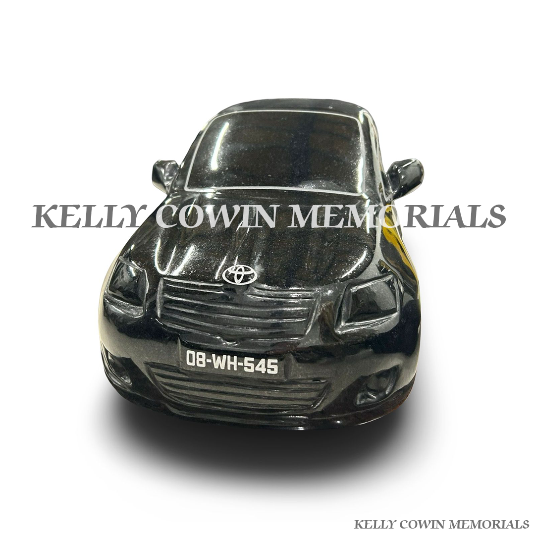 Front view of black granite Toyota Avensis memorial accessory on Pandora plinth