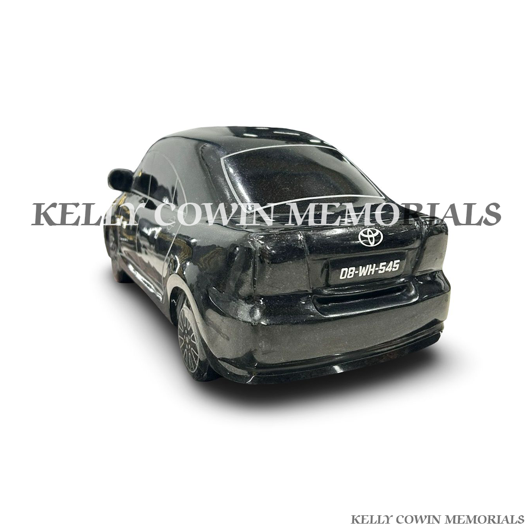 Back view of polished black granite Toyota Avensis ornament with gold wording