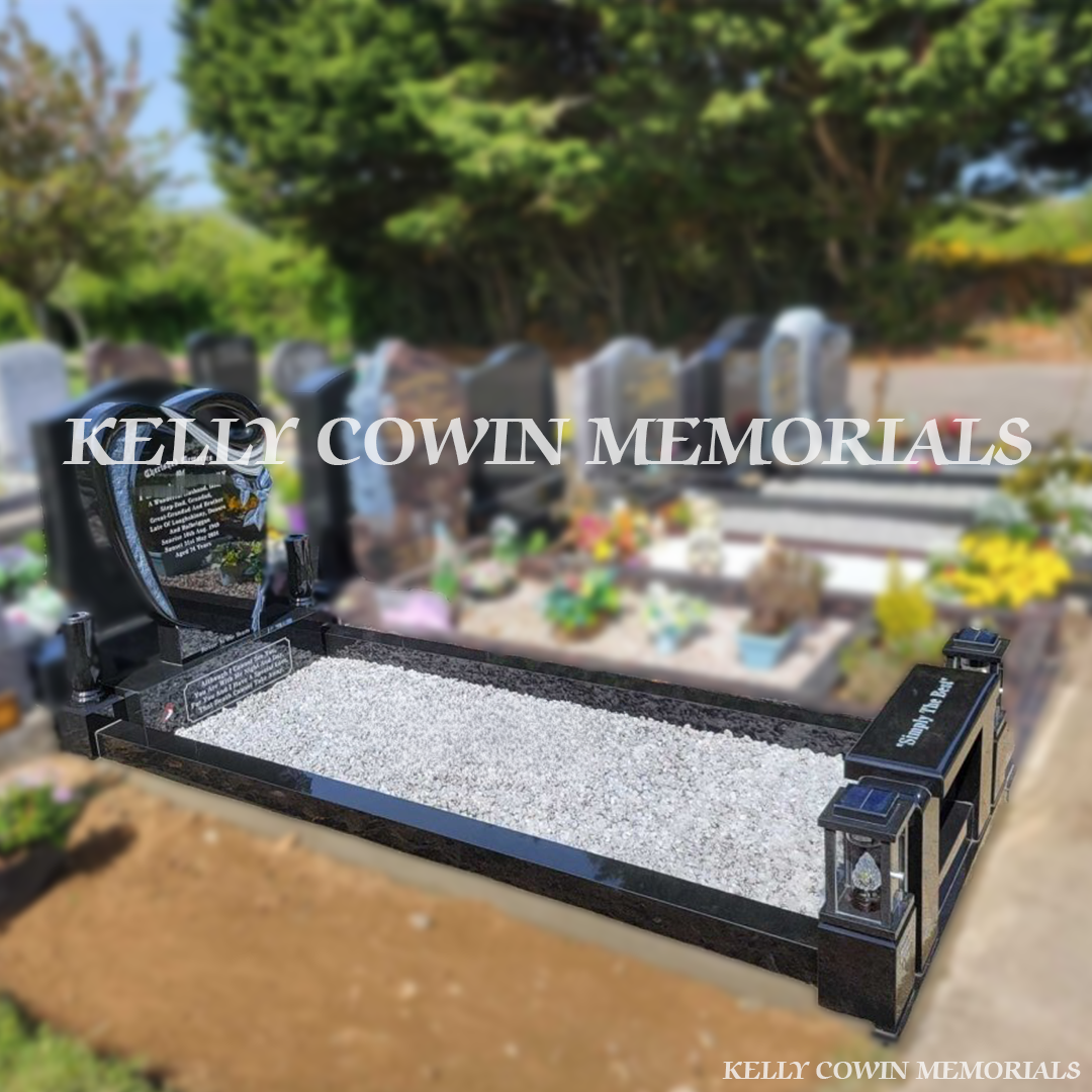 Side view showing black granite kerbing, corner posts, bench and grey granite chippings in Ardla Cemetery