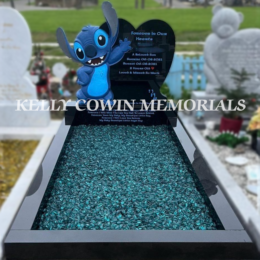 Front view of black granite Stitch heart headstone with blue inscription and turquoise glass chippings in Bohernabreena Cemetery Dublin