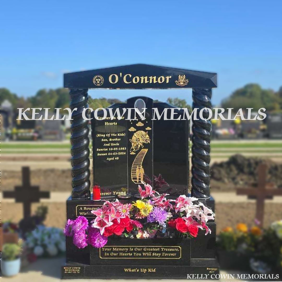 Front view of Black Granite Gates of Heaven headstone with cap and twisted pillars in Balgriffin Cemetery Dublin