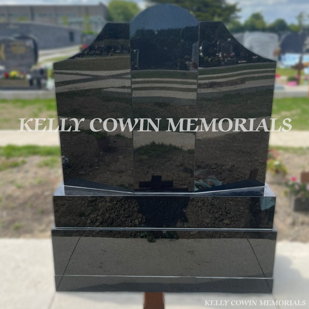 Rear view of black granite Gates of Heaven headstone with polished finish in Balgriffin Cemetery Dublin
