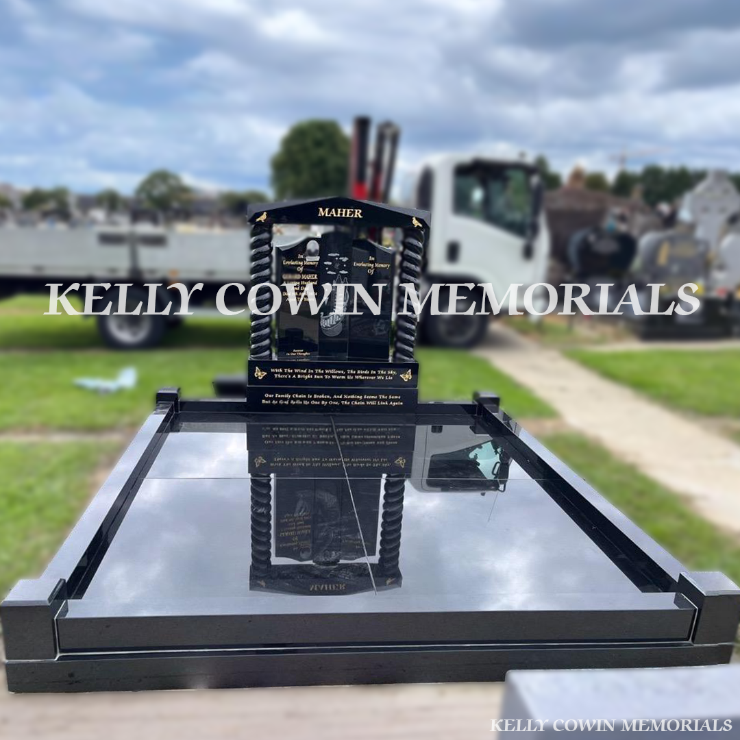 Front view of black granite Gates of Heaven headstone with gold leaf inscription in Fingal Cemetery