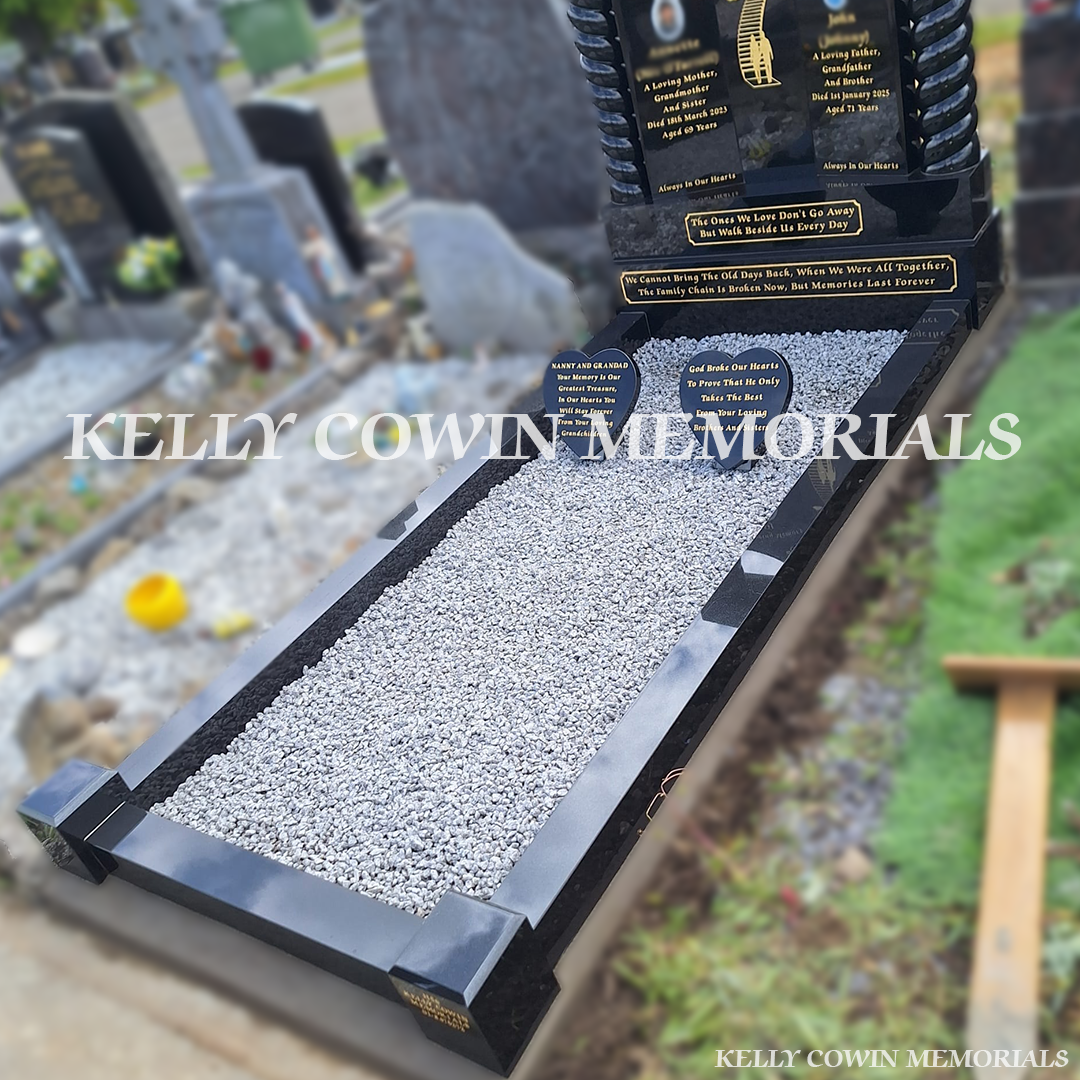 Side view of black granite memorial with kerbing and grey chippings