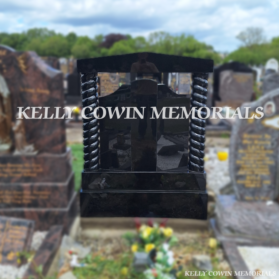 Back view of black granite memorial with kerbing and grey chippings