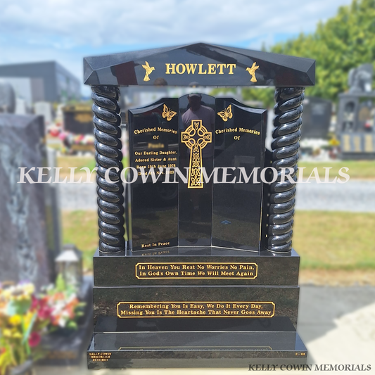Black granite Gates of Heaven headstone with twisted pillars, sub base, base, plinth and 23.5ct gold leaf inscription installed in Dardistown Cemetery, Dublin by Kelly Cowin Memorials.