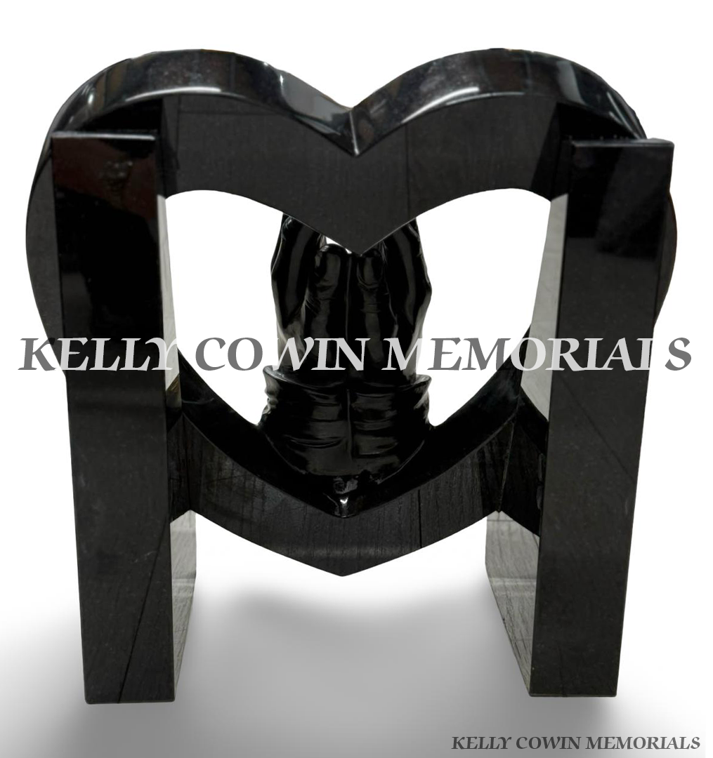 Back view of custom black granite open heart memorial with polished granite supports and praying hands centrepiece.