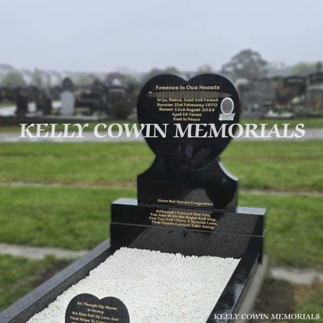 Front view of black granite heart headstone with gold inscription, full kerbing and corner posts erected in Fingal Cemetery Dublin