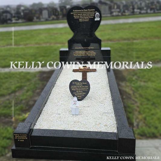 Front view of black granite heart headstone with gold inscription, full kerbing and corner posts erected in Fingal Cemetery Dublin