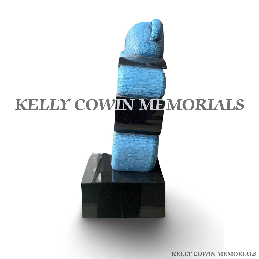 Side view of teddy bear memorial accessory on granite plinth