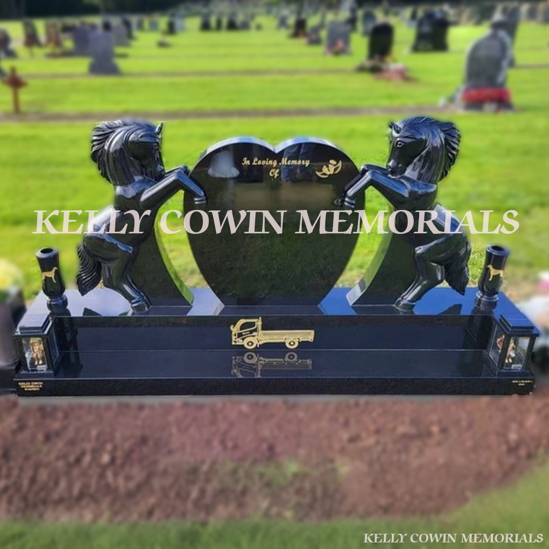 Black granite horse holding heart-shaped memorial headstone with gold engraving and tall vases by Kelly Cowin Memorials Ireland
