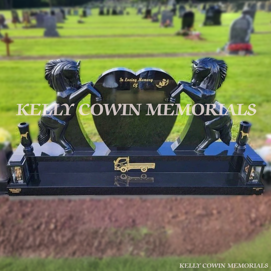 Black granite horse holding heart-shaped memorial headstone with gold engraving and tall vases by Kelly Cowin Memorials Ireland