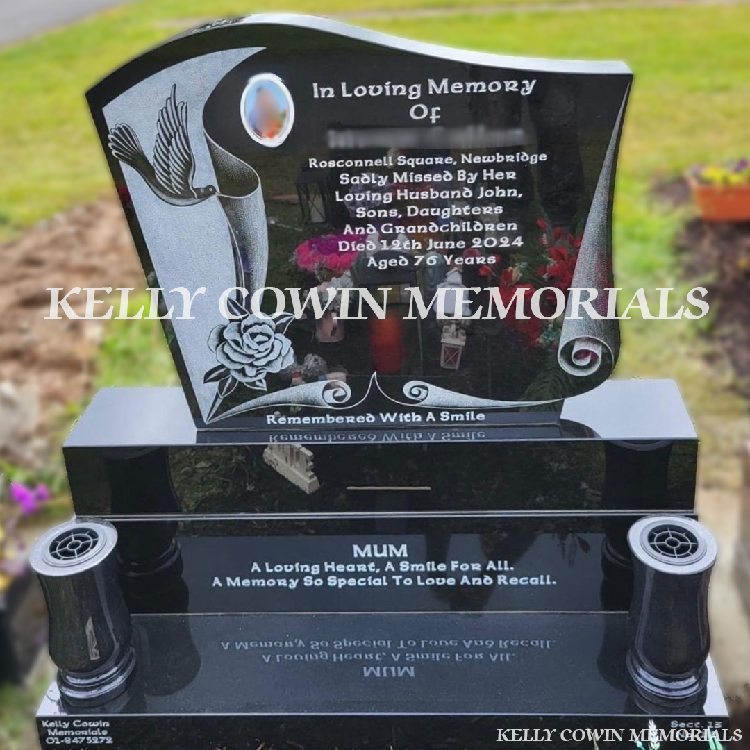 Front view of black granite headstone with laser dove image in Newcastle Cemetery