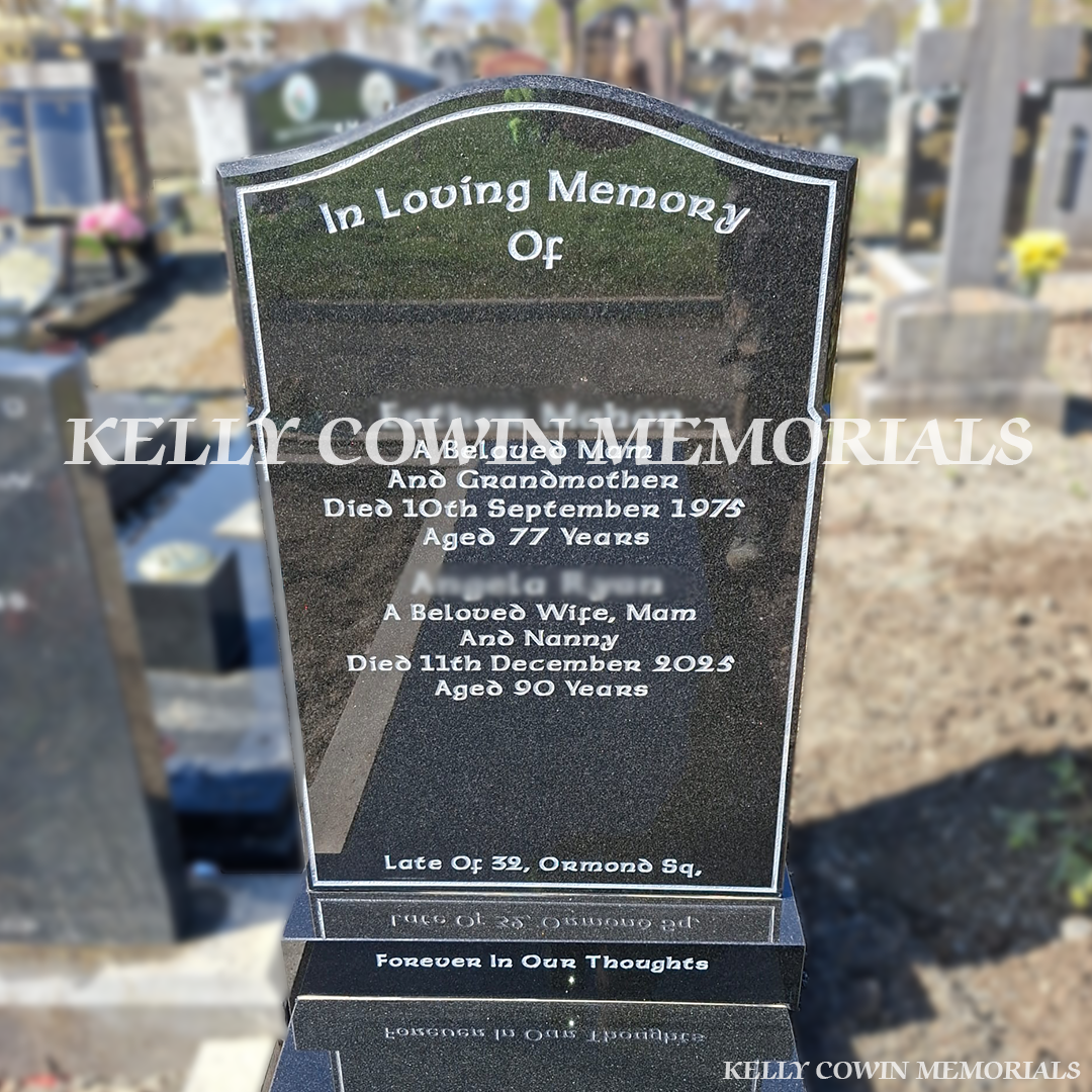 Close Up view of black granite OG headstone with silver inscription in Glasnevin Cemetery