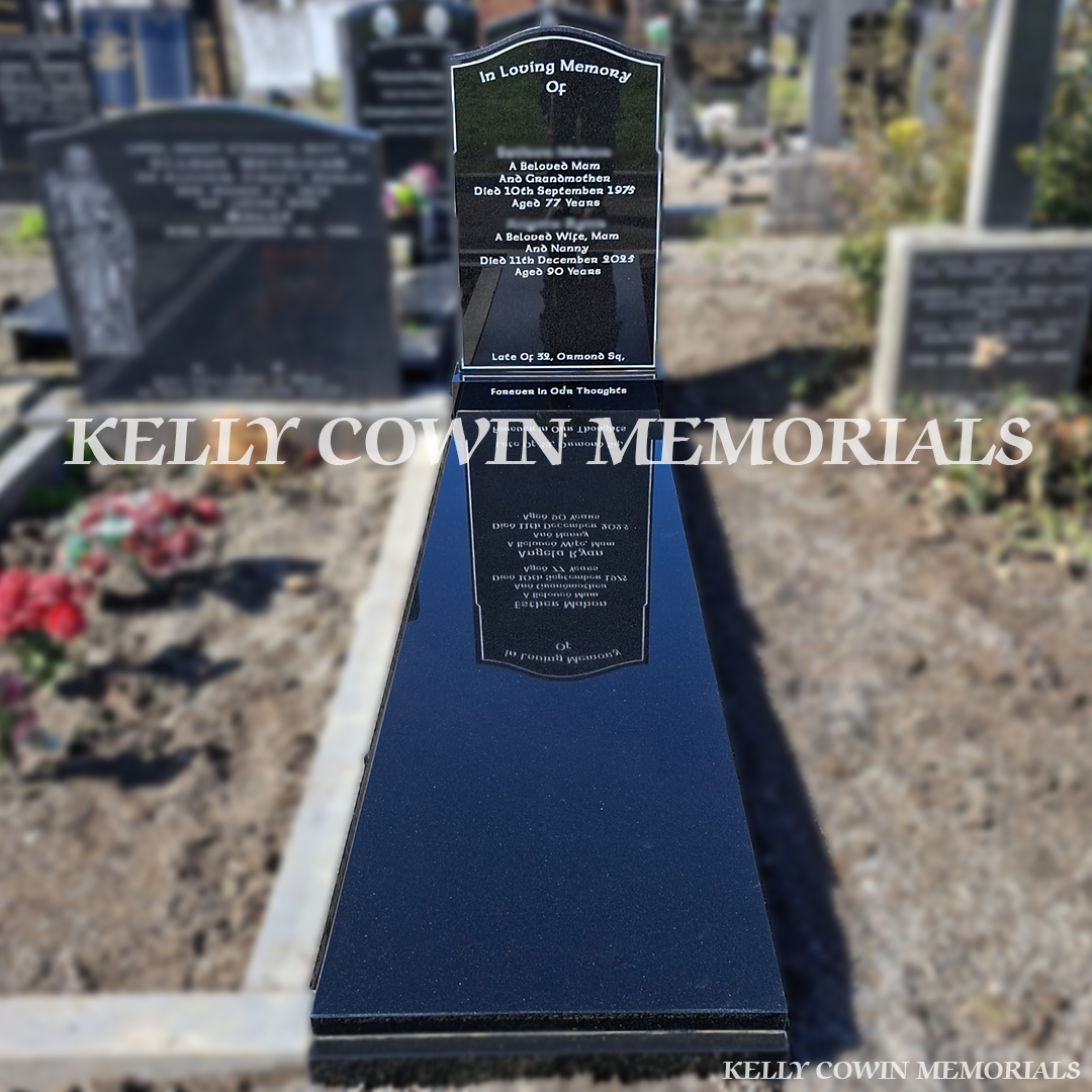 Front view of black granite OG headstone with silver inscription in Glasnevin Cemetery