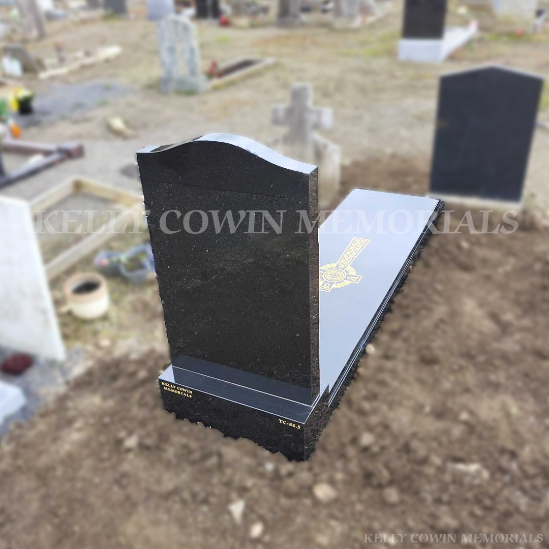Back profile of an OG-shaped Black Granite headstone with kerbing and full slab, installed by Kelly Cowin Memorials in Glasnevin Cemetery, Dublin.