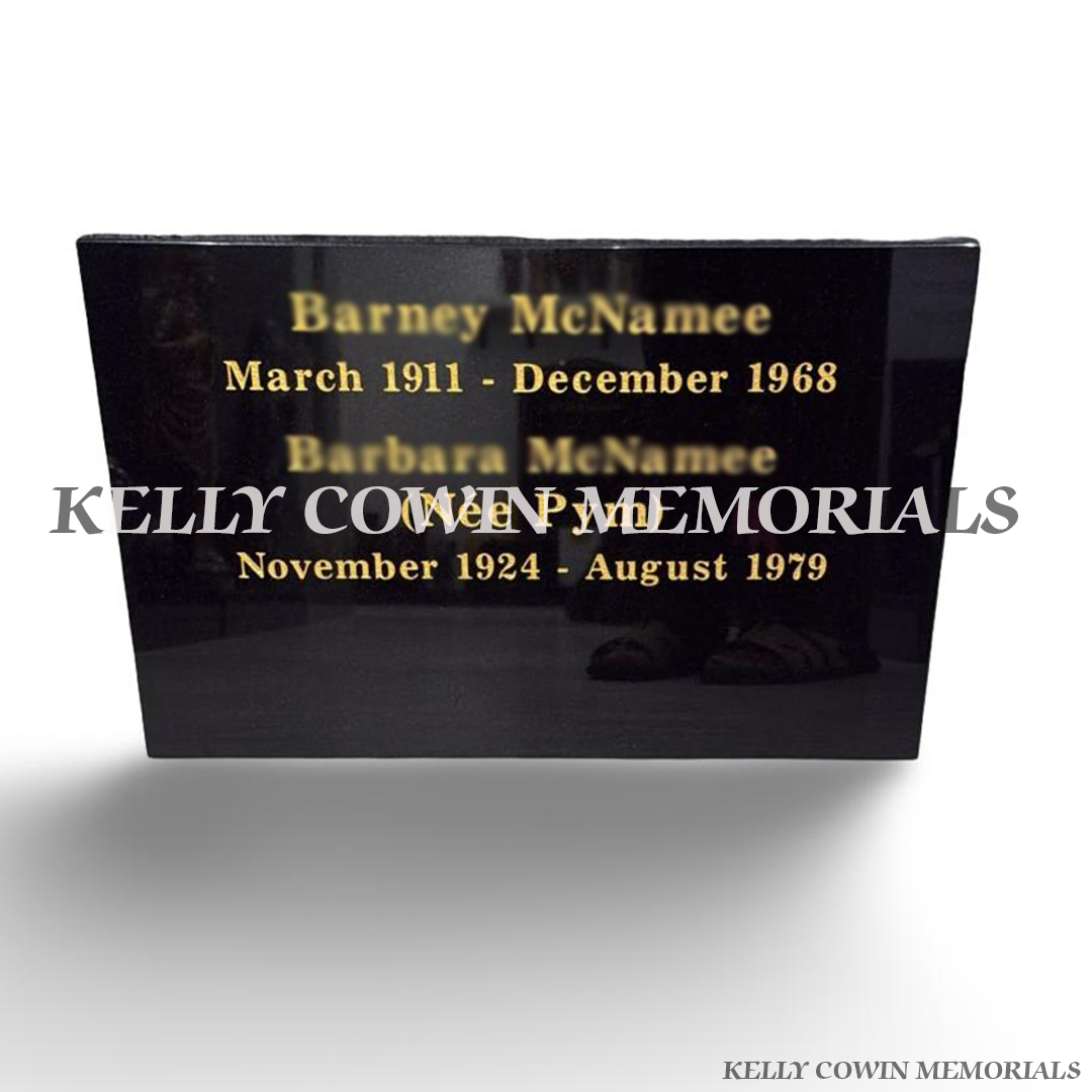 Polished black granite memorial plaque with personalised gold engraved names and dates from Kelly Cowin Memorials Ireland.