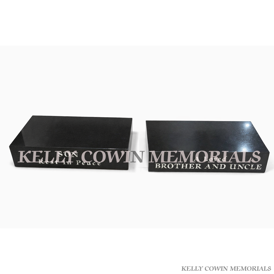 Polished black granite memorial plinth base with engraved inscription for grave accessories by Kelly Cowin Memorials Ireland