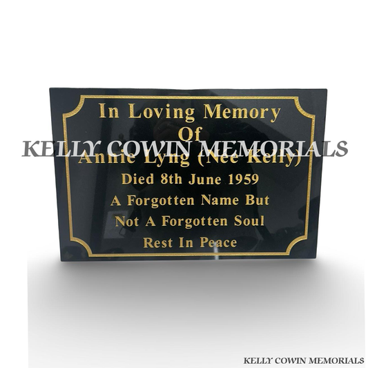 Front view of black granite memorial plaque with gold wording and border