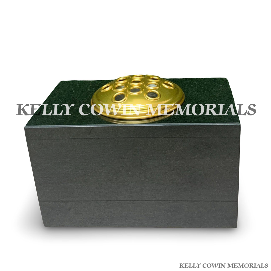 Front view of black granite rectangular vase with gold lid