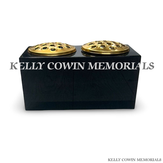 Front view of black granite rectangular vase with two gold lids