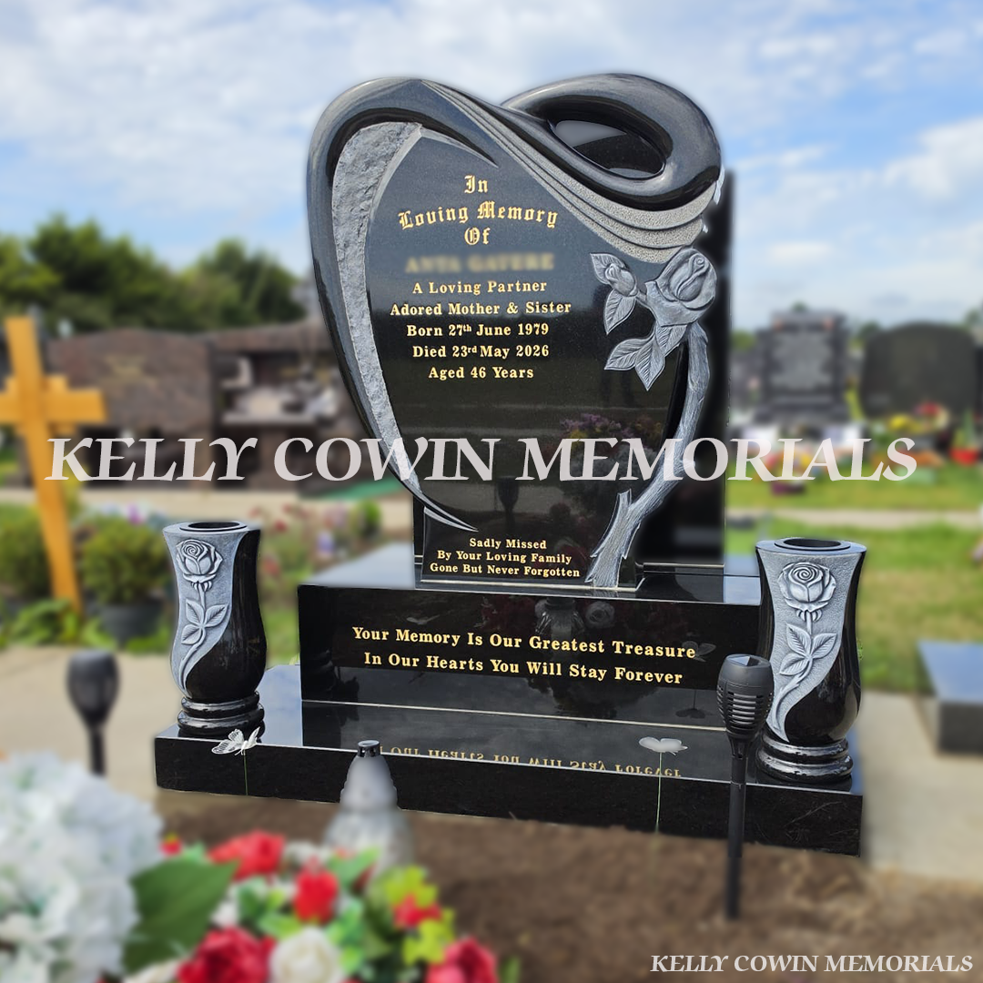 side view of Black granite rose carved headstone with gold inscription, base, plinth and two matching rose vases in Dundalk Cemetery, County Louth
