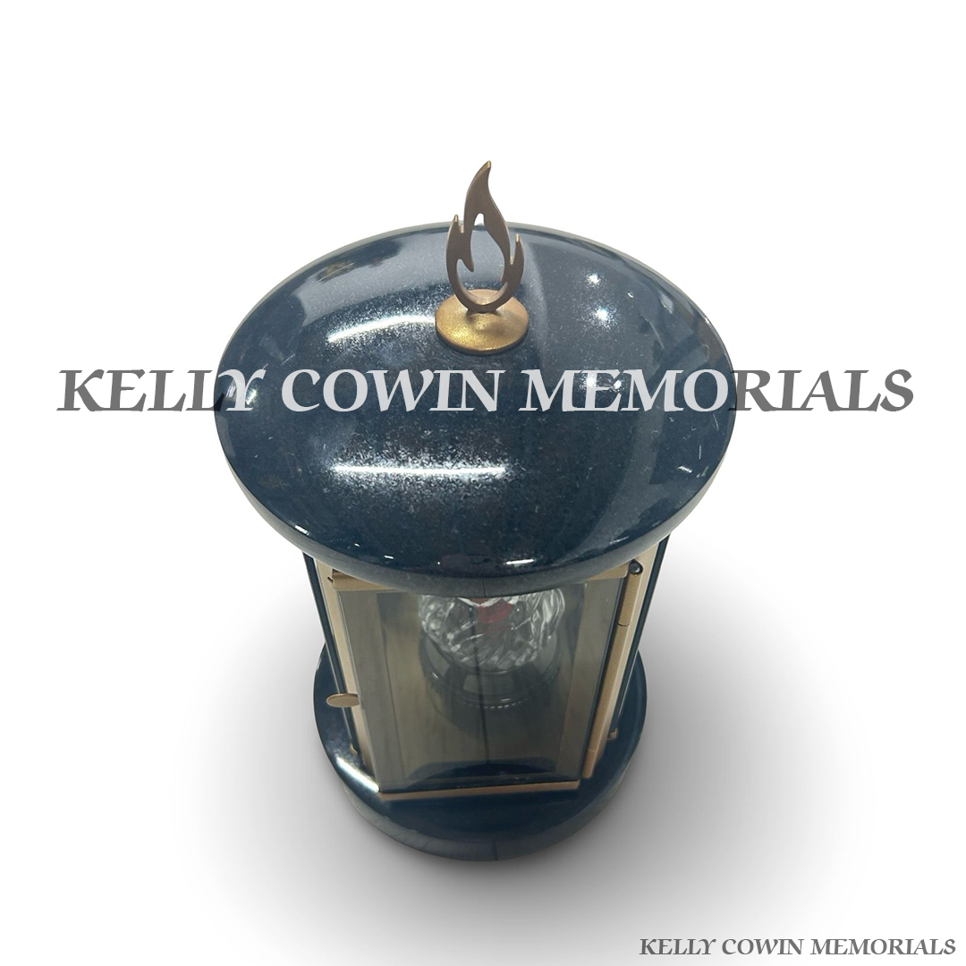Close-up of bronze hardware and detailing on black granite lantern