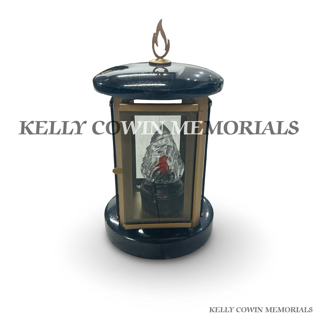 Front view of black granite round lantern with bronze detailing