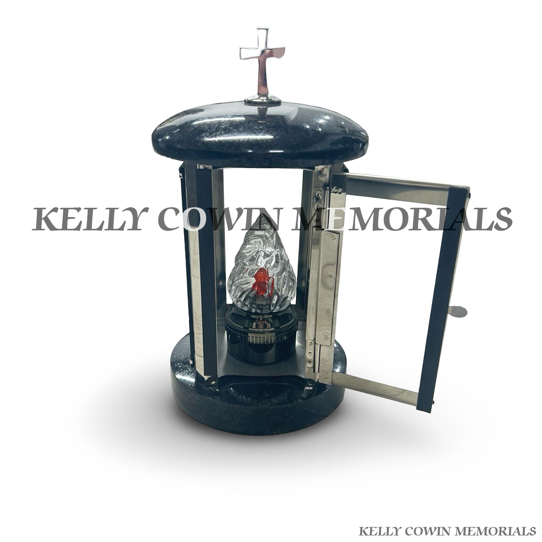 Front view of black granite round lantern with silver cross detail