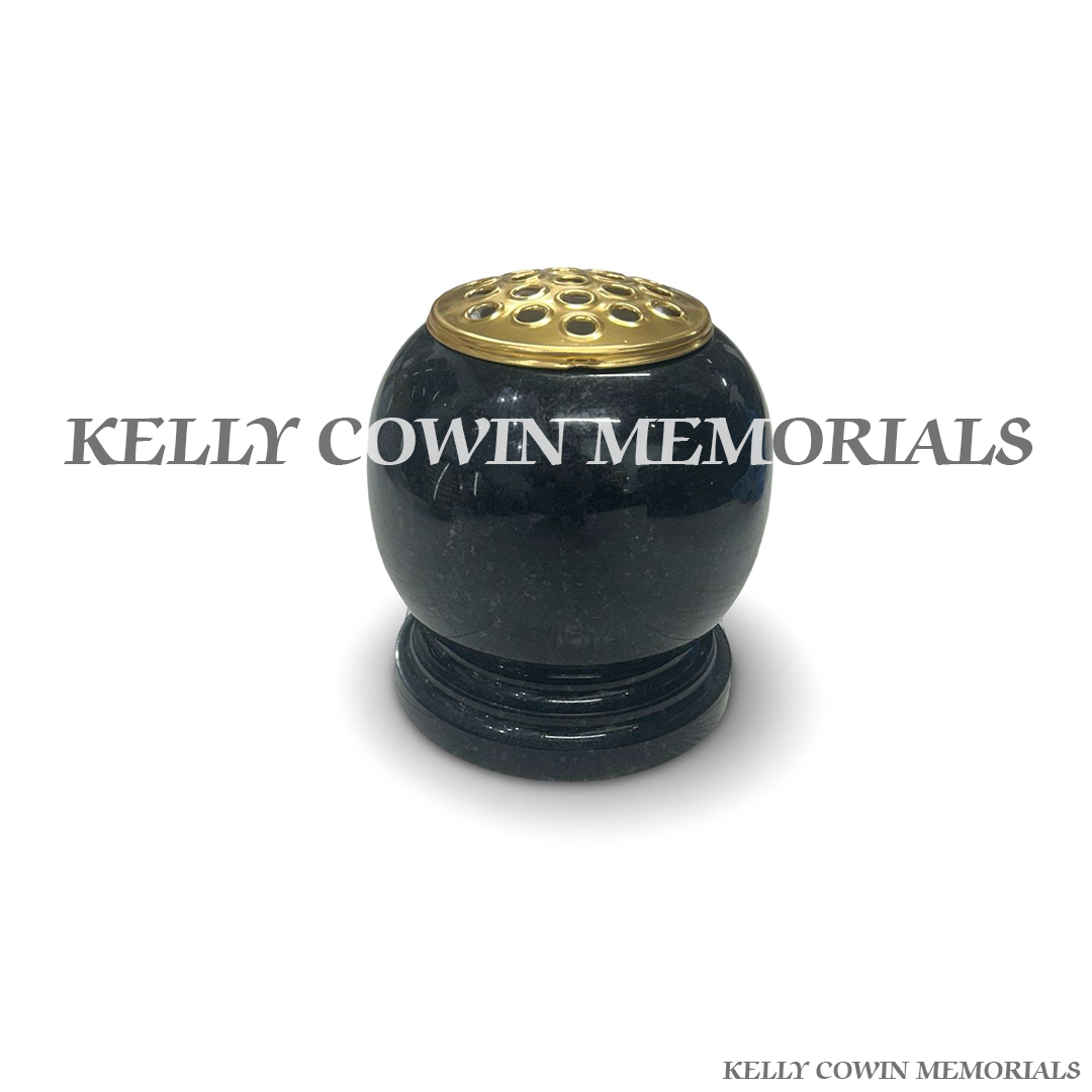 Front view of black granite urn shaped vase with gold lid
