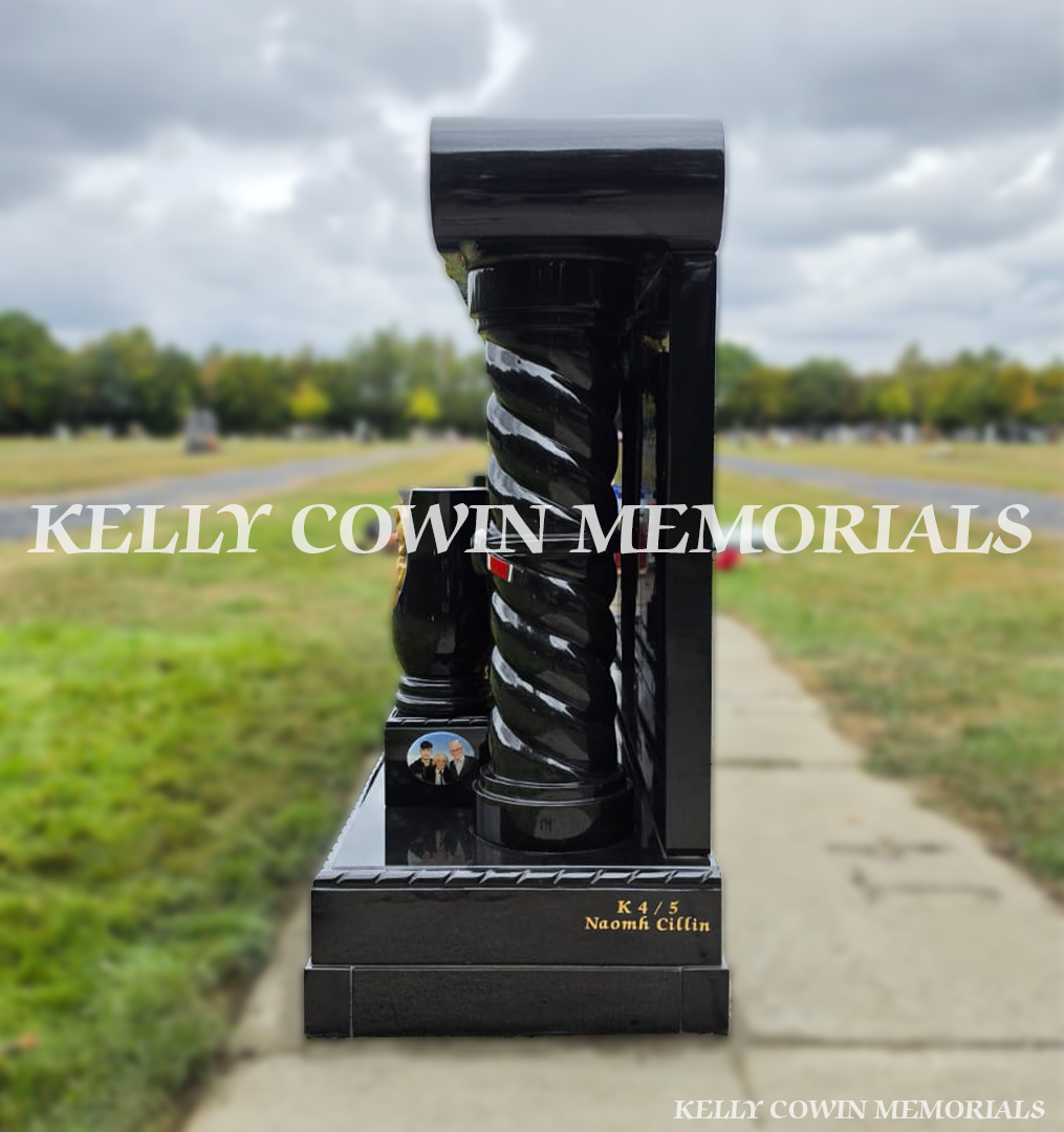 Side view of custom black granite memorial showing twisted pillar, scroll cap and polished granite construction in Newlands Cross Cemetery Dublin.