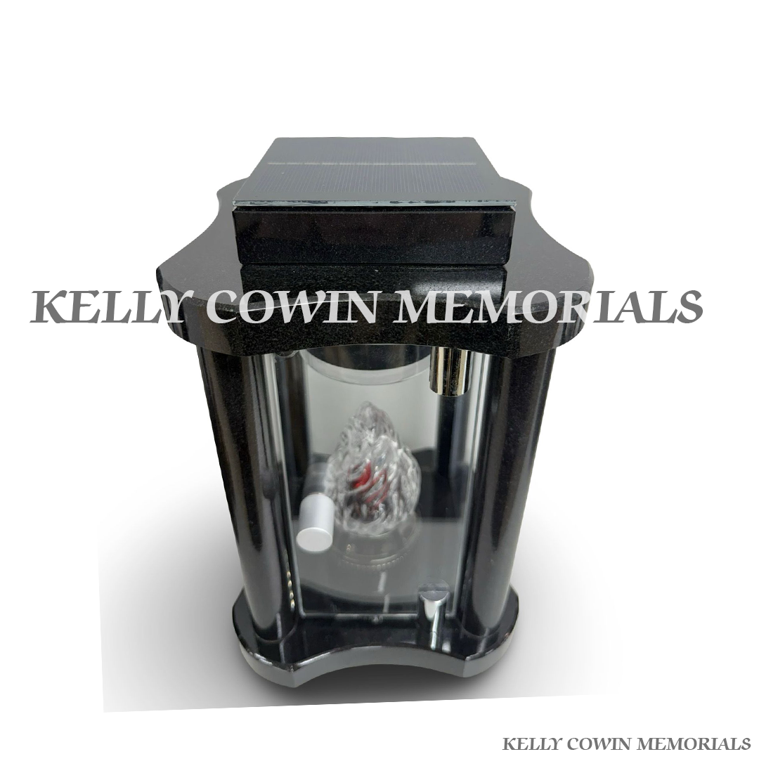 Close-up of solar light detail on black granite lantern