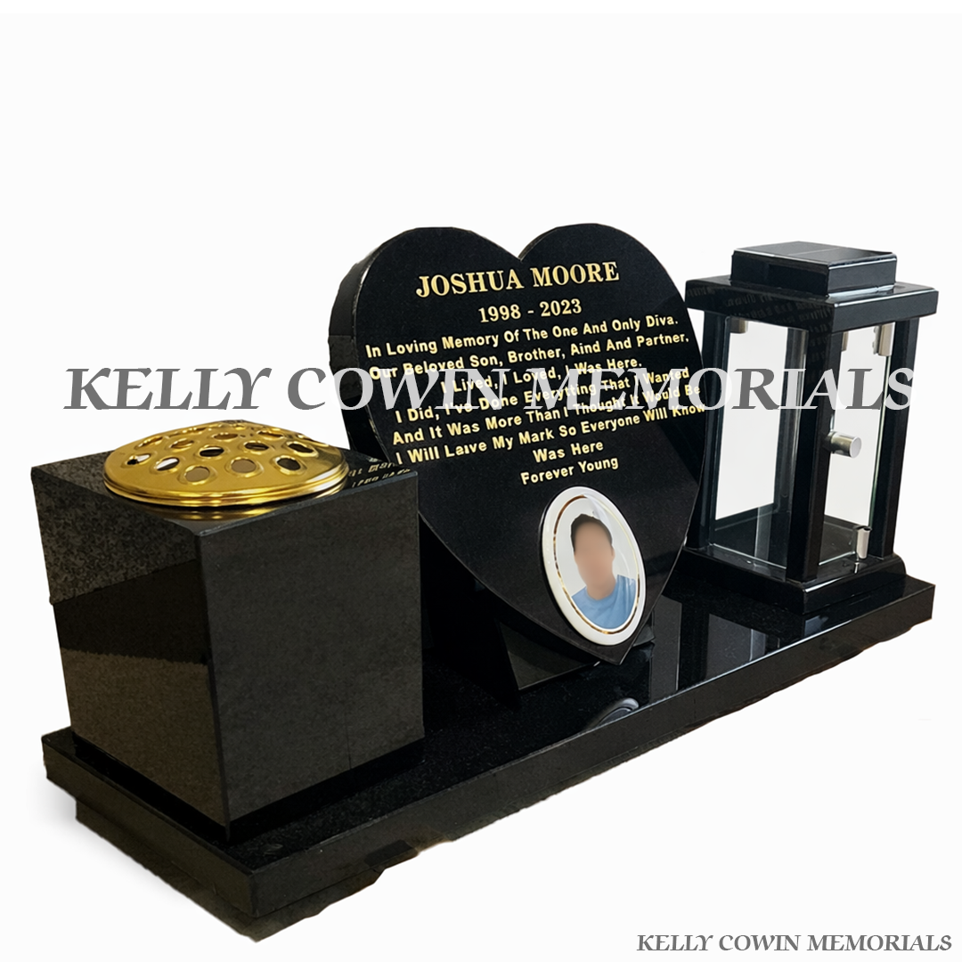 Side view of black granite memorial set with lantern, ceramic photo and gold lid vase