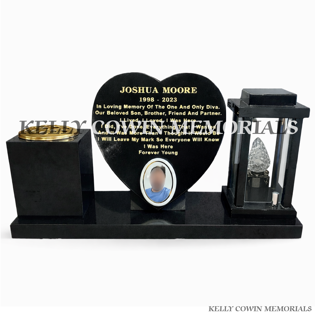Front view of black granite solar lantern, heart and vase set on polished plinth