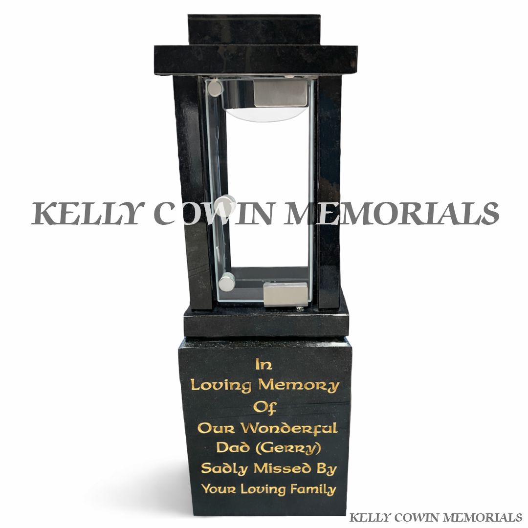 Front view of black granite solar lantern with gold engraved inscription