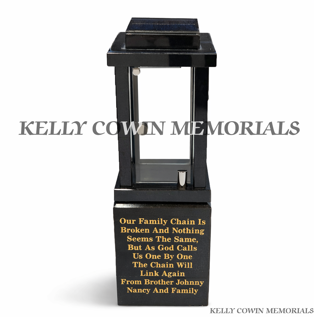 Front view of black granite solar lantern with gold engraved poem