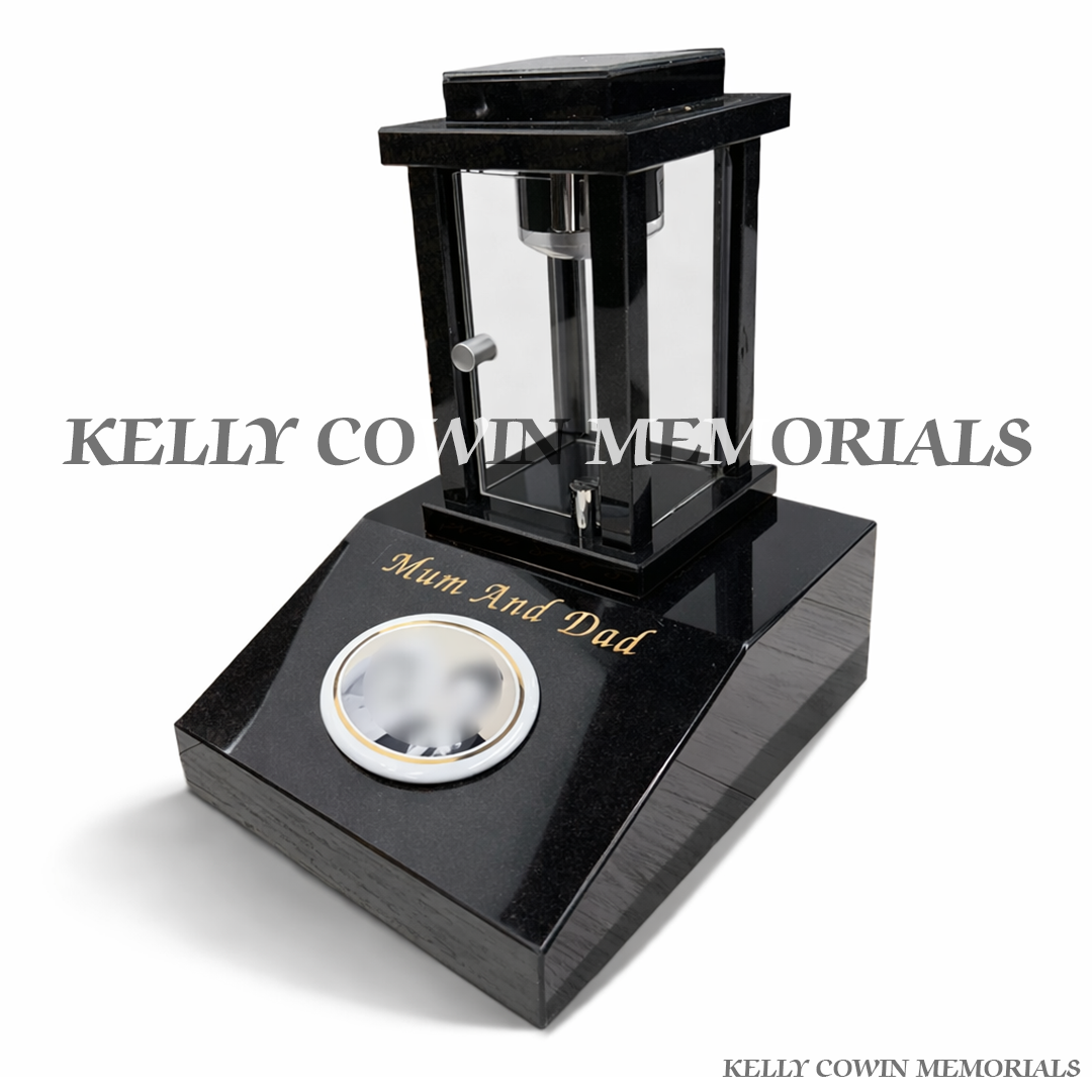 Side view of black granite sloped memorial block with mounted solar lantern